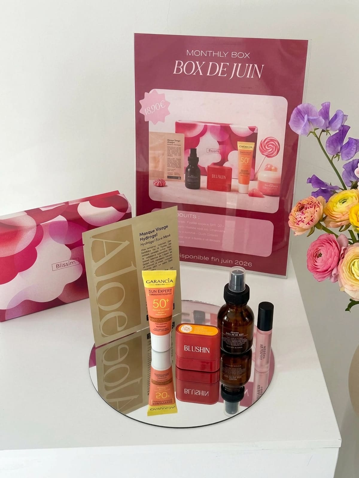 Exemple de la box Blissim juin 2026 avec les produits Garancia, Blushin, Mimitika et Davines
